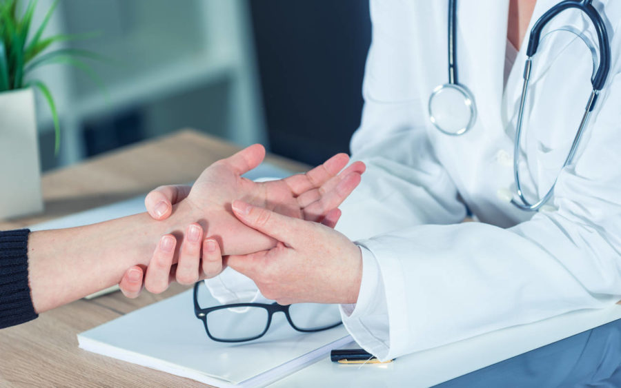 female patient at orthopedic doctor medical exam penzg4l 1 e1609862590635 1