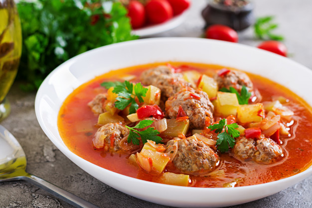 hot stew tomato soup with meatballs and vegetables closeup in a bowl on the table albondigas soup spanish and mexican food 2829 6037